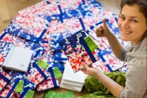 Kompletace 100 ks zápisníků pro AXA Assistance